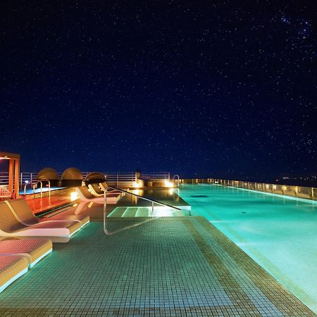 Kensington Jeju Hotel Esterno foto Rooftop pool at the hotel